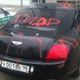 Illustration for article titled This is what a Bentley Continental GT looks like after Russian vandals are done with it